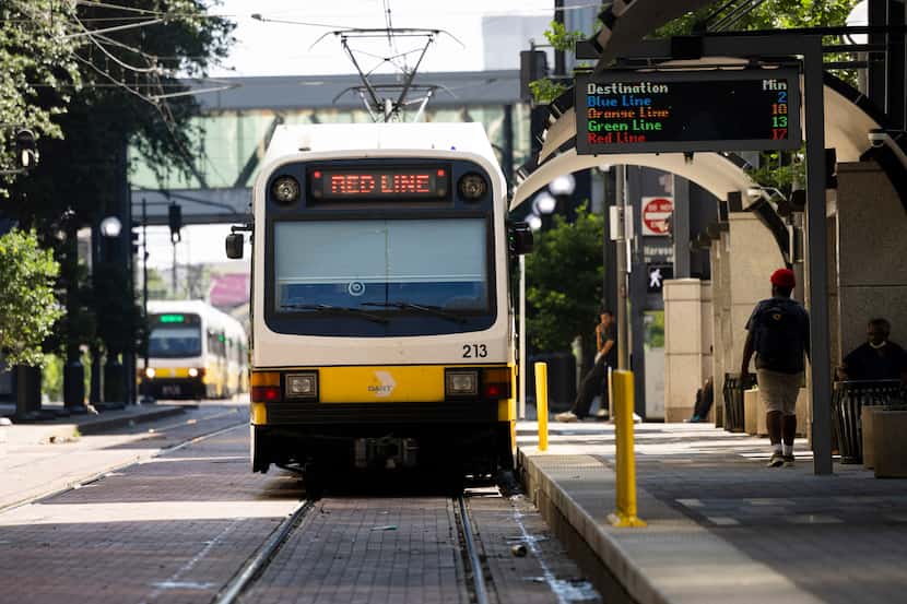 The red line Dallas Area Rapid Transit rail stopped at the St. Paul Station in downtown...