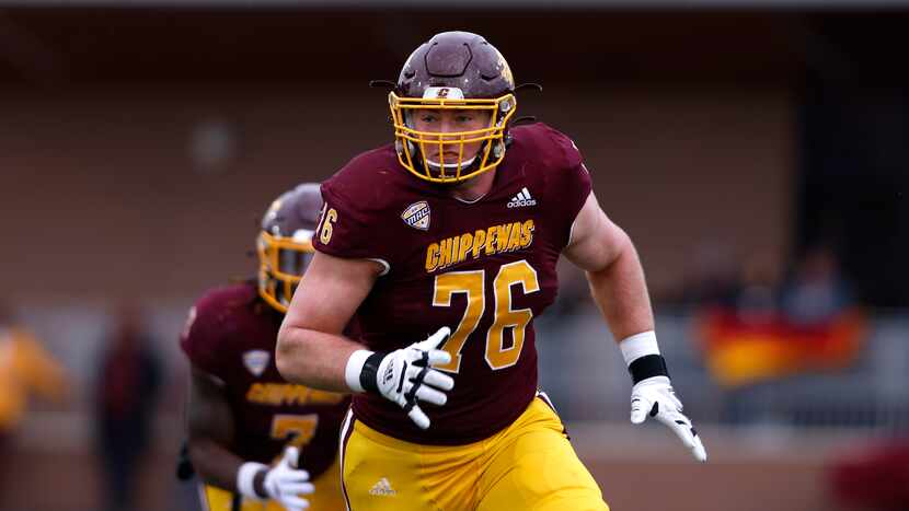 Central Michigan offensive lineman Bernhard Raimann plays during an NCAA college football...