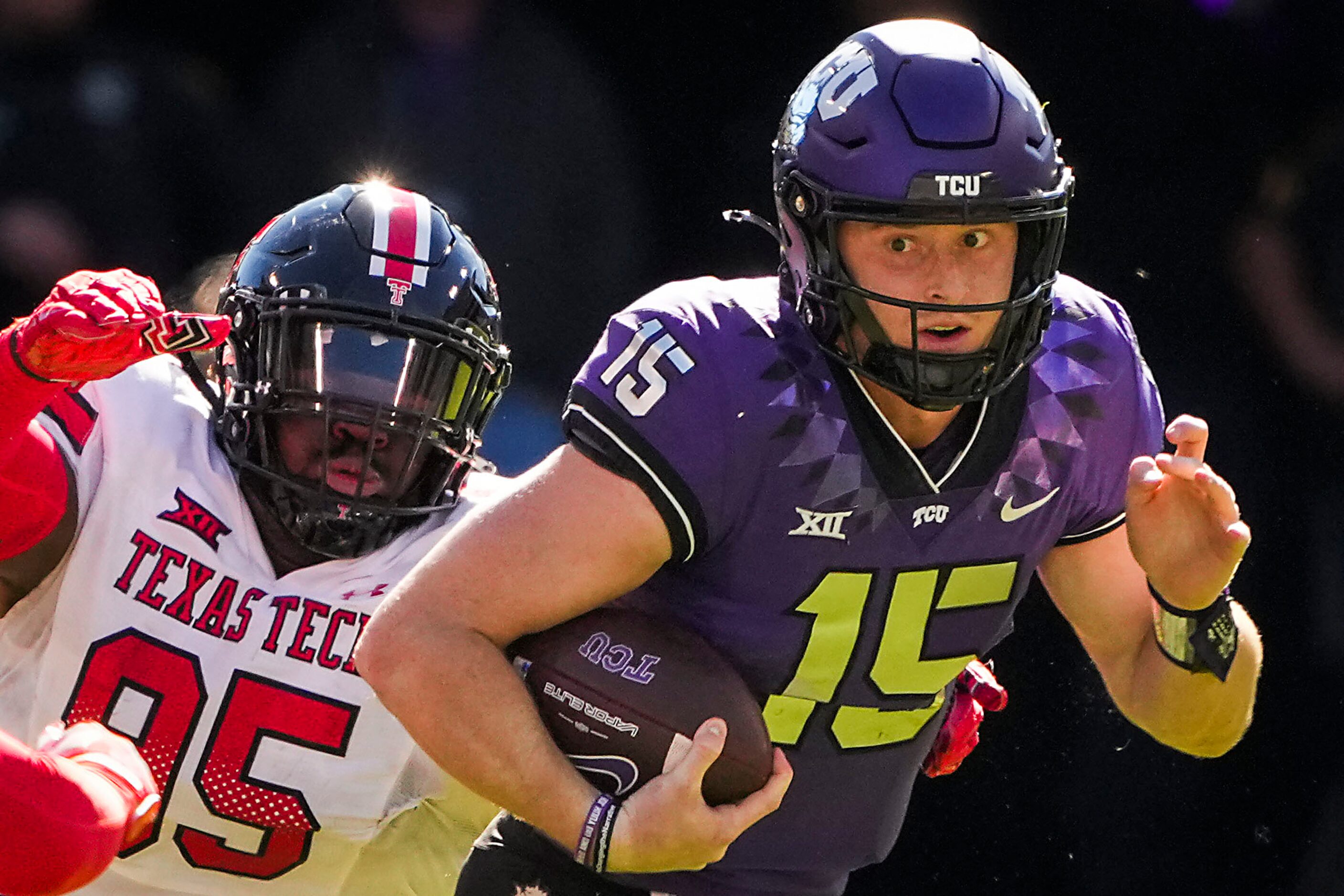 TCU quarterback Max Duggan (15) scrambels away from Texas Tech defensive lineman Jaylon...