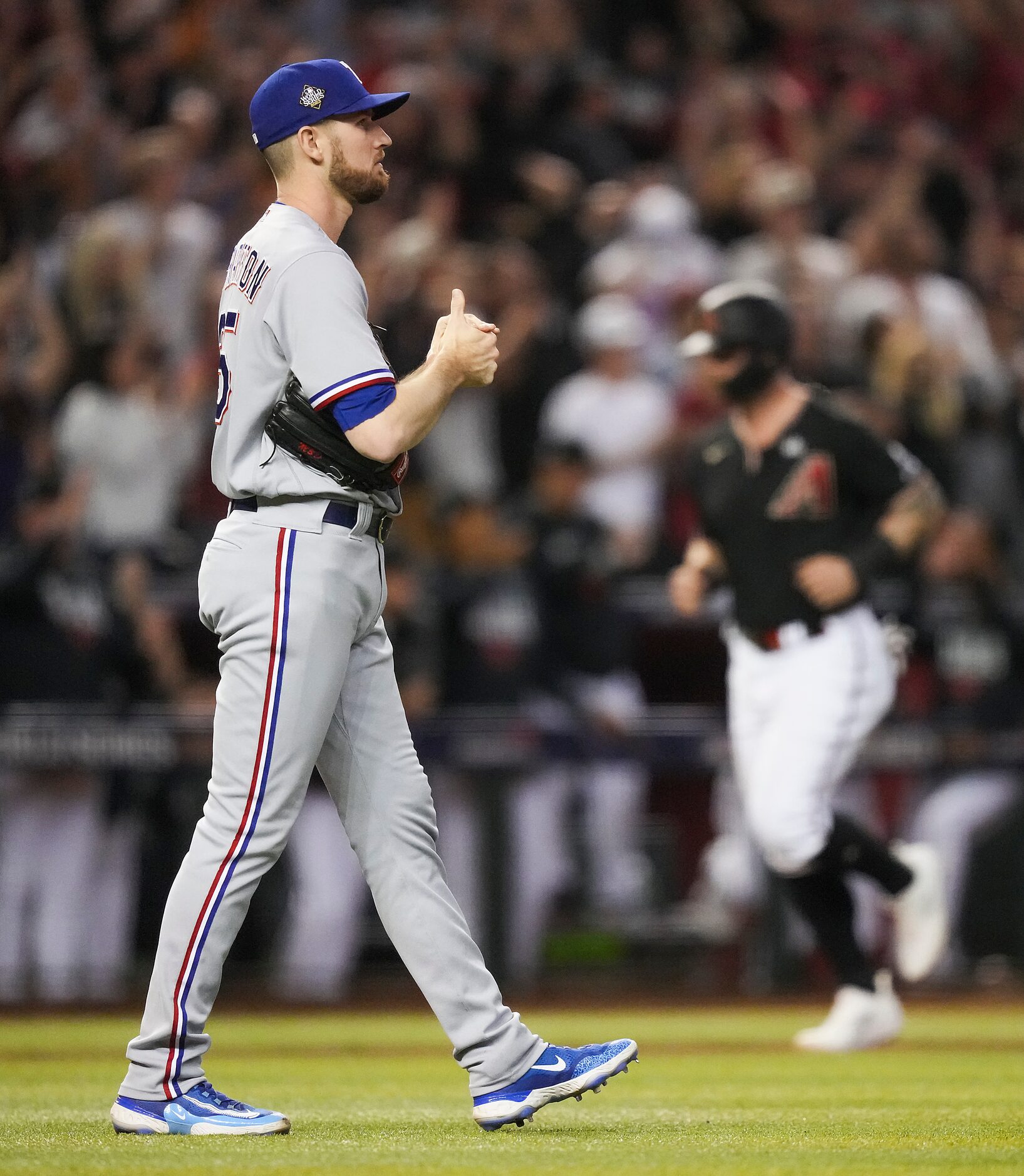 Texas Rangers relief pitcher Chris Stratton gets a new ball after a three-run home run by...