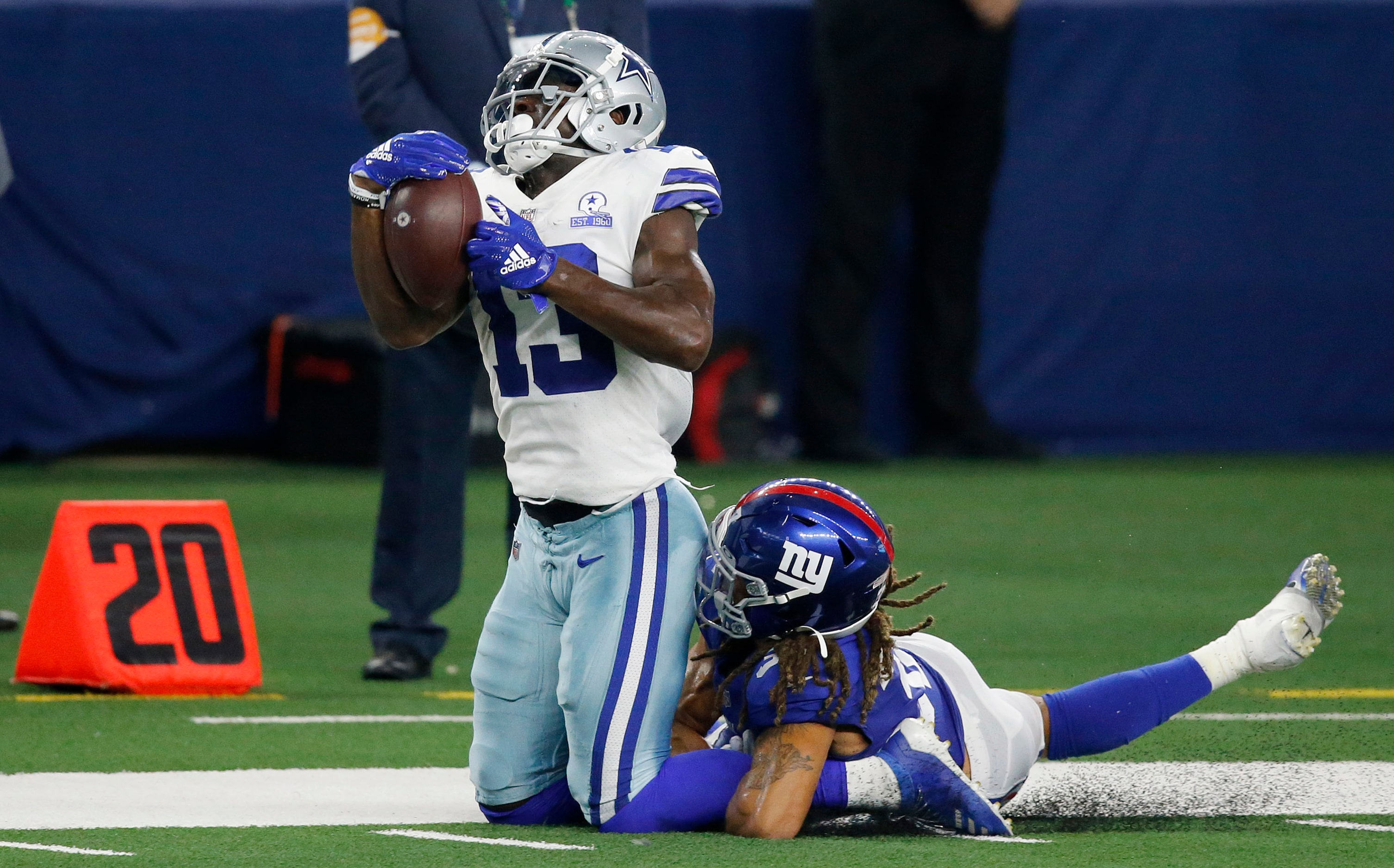 Dallas Cowboys wide receiver Michael Gallup (13) reaches back for a long pass completion...