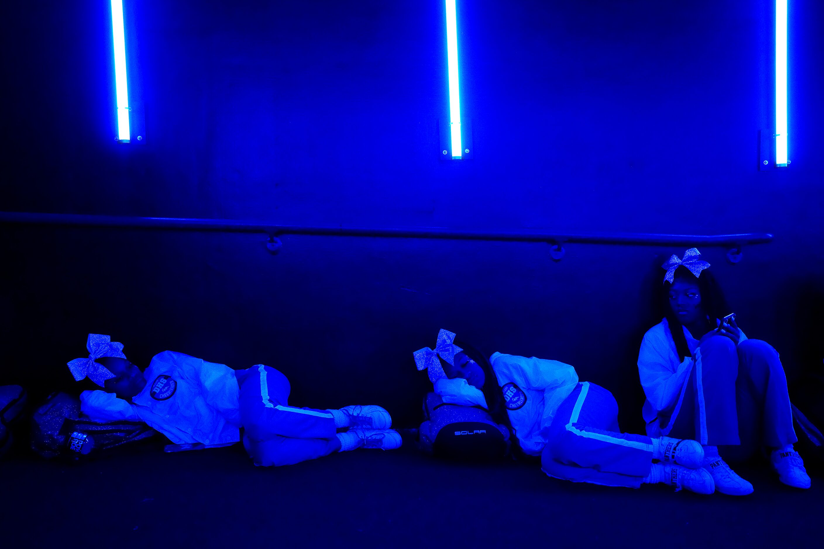 Duncanville cheerleaders wait in the tunnel during a lightning delay in the first half of a...