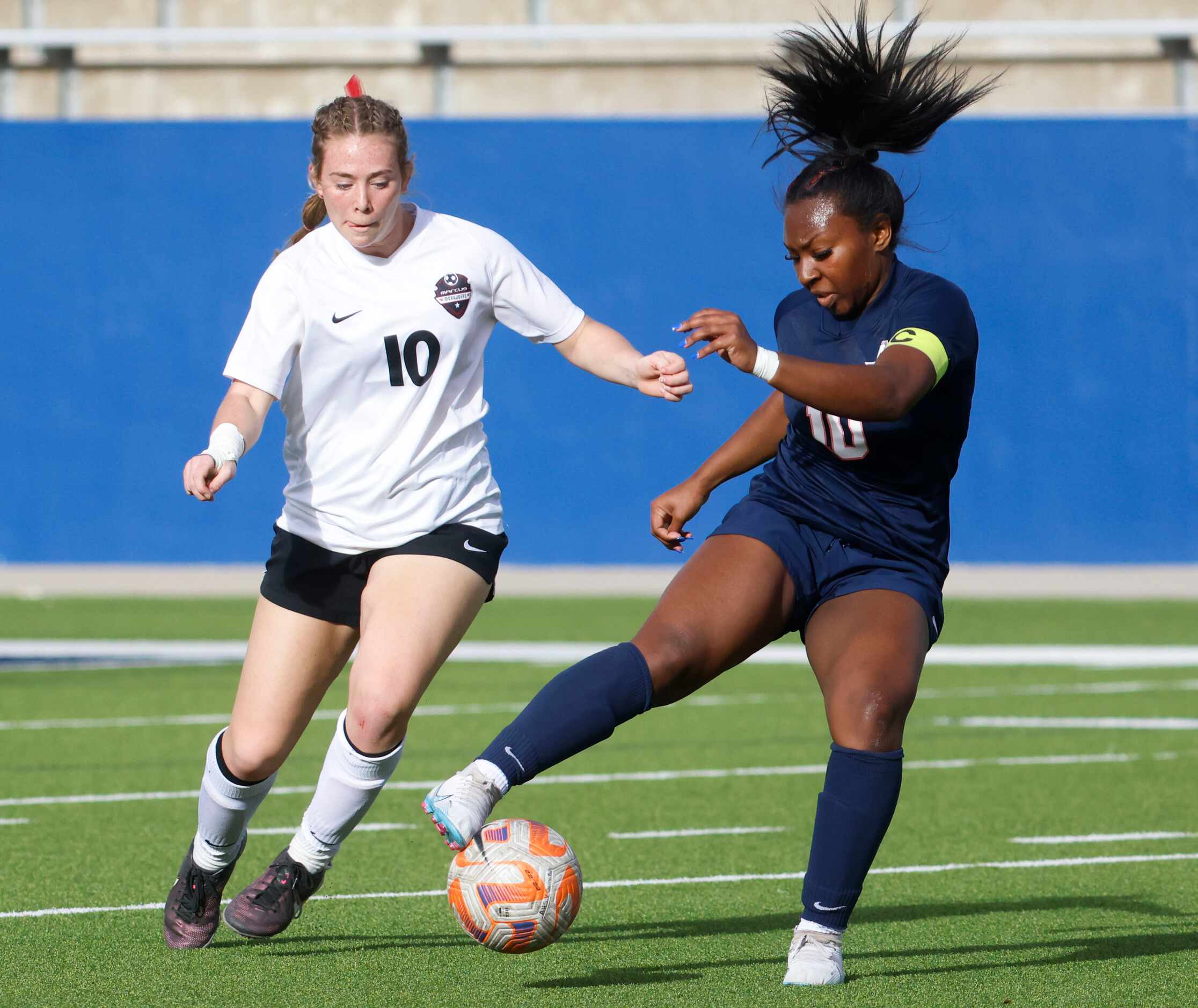 Allen’s Melania Fullerton (right) defends the ball against Marcus’ Allie Williams during the...