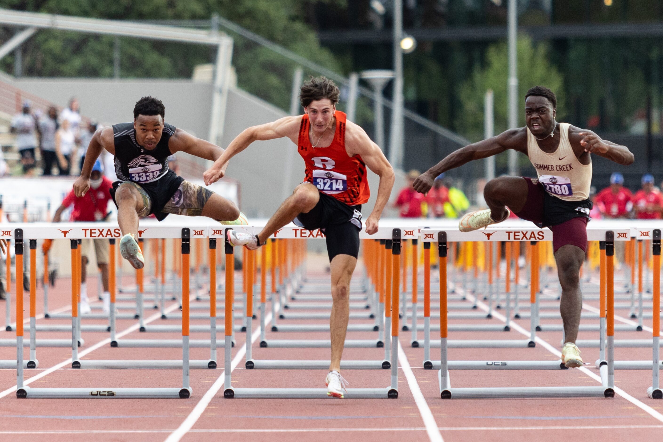 Samuel Alves of Rockwall, center, races toward the finish in the boys’ 110-meter hurdles at...