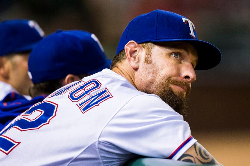 Texas Rangers left fielder Josh Hamilton (32) reacts to a 12-4 score during the ninth inning...