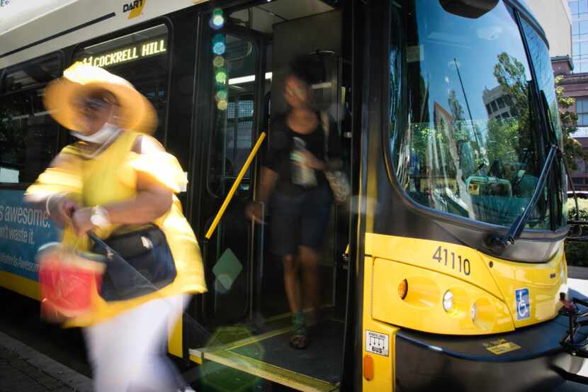People exit a DART bus in downtown Dallas on Monday, July 10, 2017. (Tailyr Irvine/The...