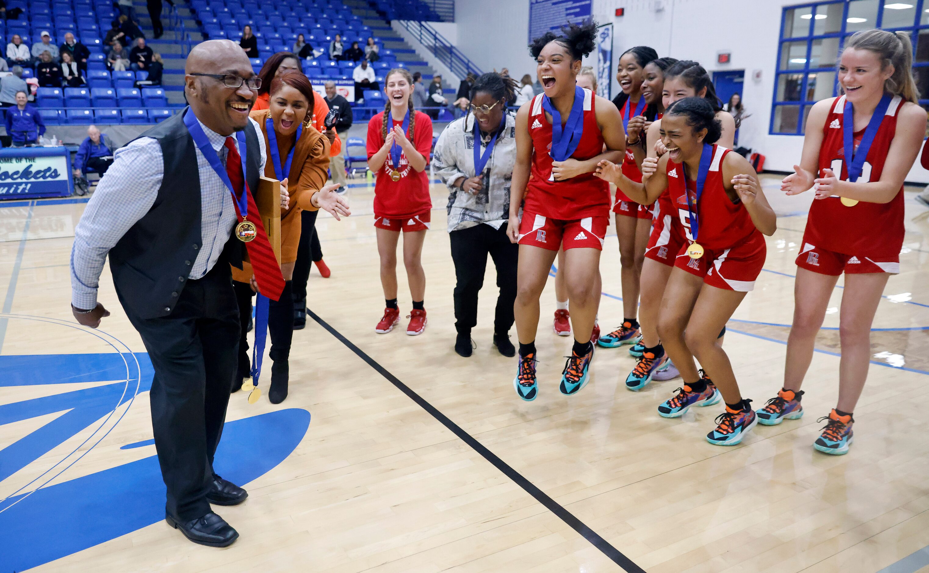 At the coaxing of his players, John Paul II head coach John Griffin does The Griddy dance...