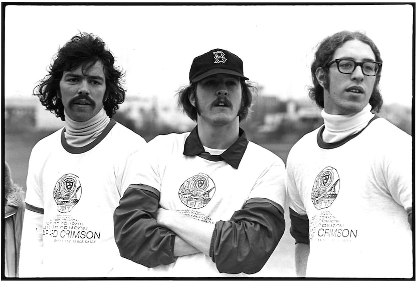 Robert Decherd (center) is flanked by Mike Dake (left) and Steve Luxenberg on the sideline...