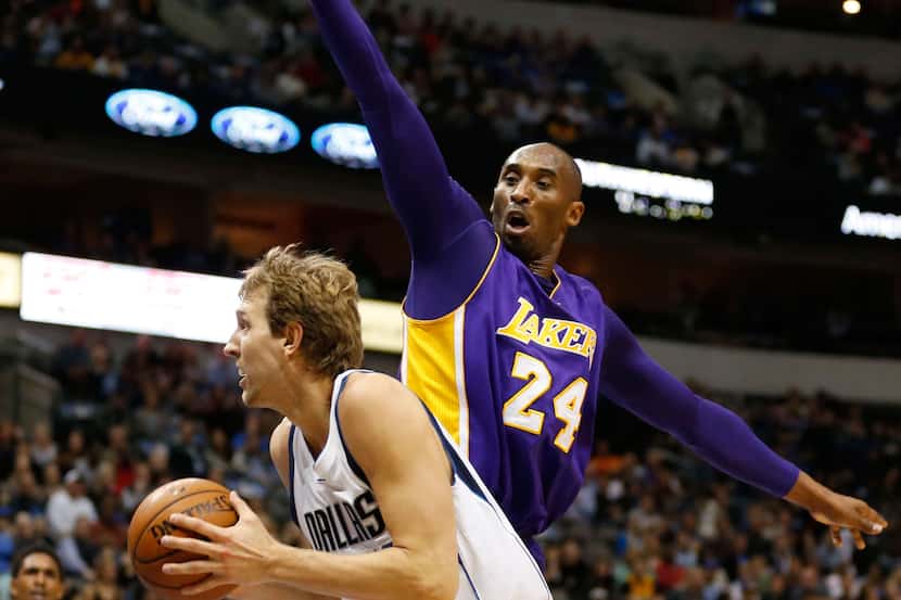 Mavericks forward Dirk Nowitzki scores on Lakers forward Kobe Bryant. (Vernon Bryant/The...