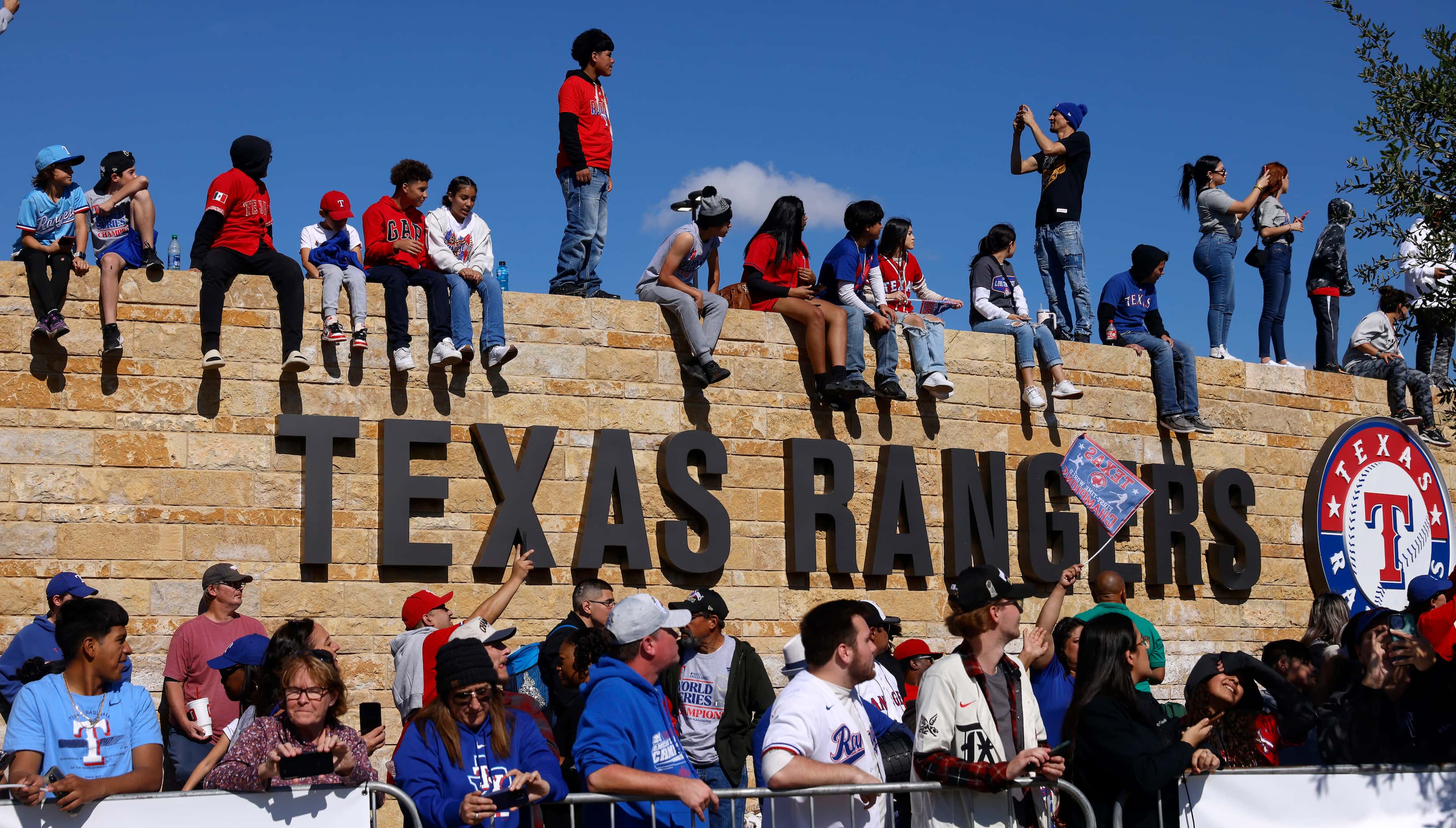 Texas Rangers fans line the wall outside of Globe Life Field for the World Series Victory...