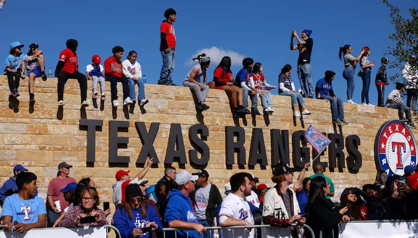 Texas Rangers fans line the wall outside of Globe Life Field for the World Series Victory...