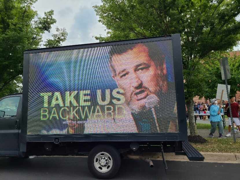 The Democratic National Committee stationed an electronic billboard outside the site of a...