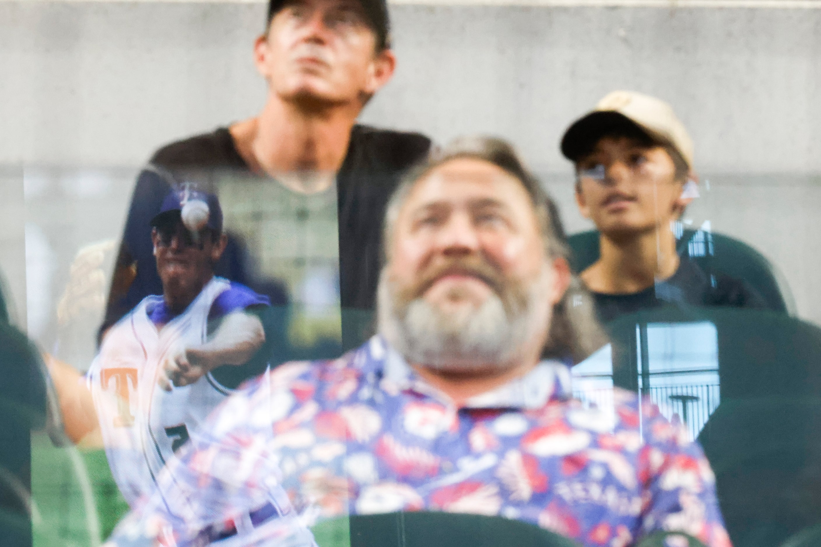 Spectators watch a video of Former Texas Ranger Ian Kinsler  ahead of his induction ceremony...