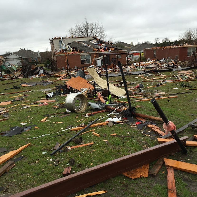 A view from the end zone on Field 2 reveals a path of debris a day after a tornado struck a...