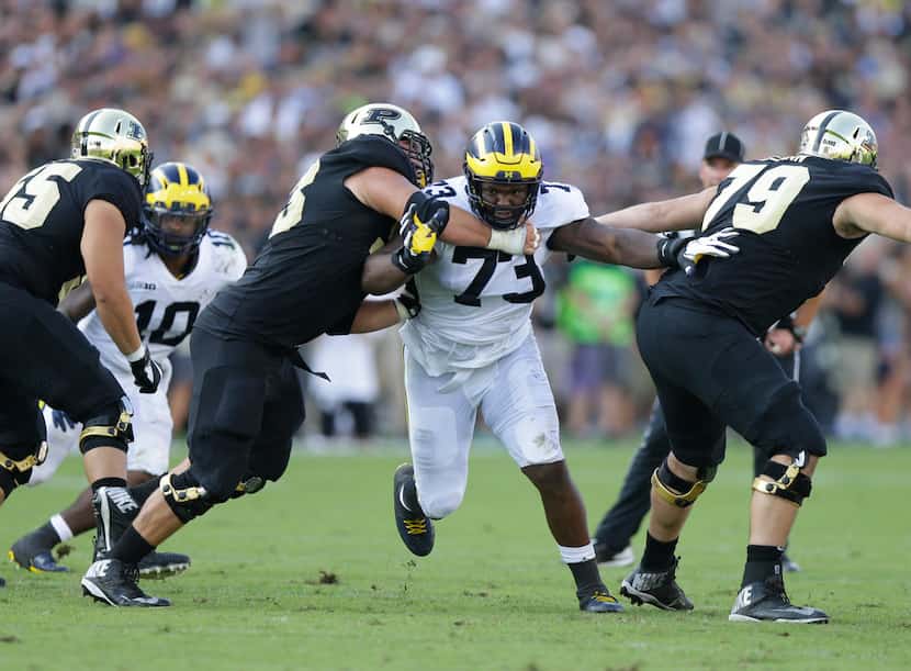 FILE - In this Sept. 23, 2017, file photo, Michigan defensive lineman Maurice Hurst (73)...