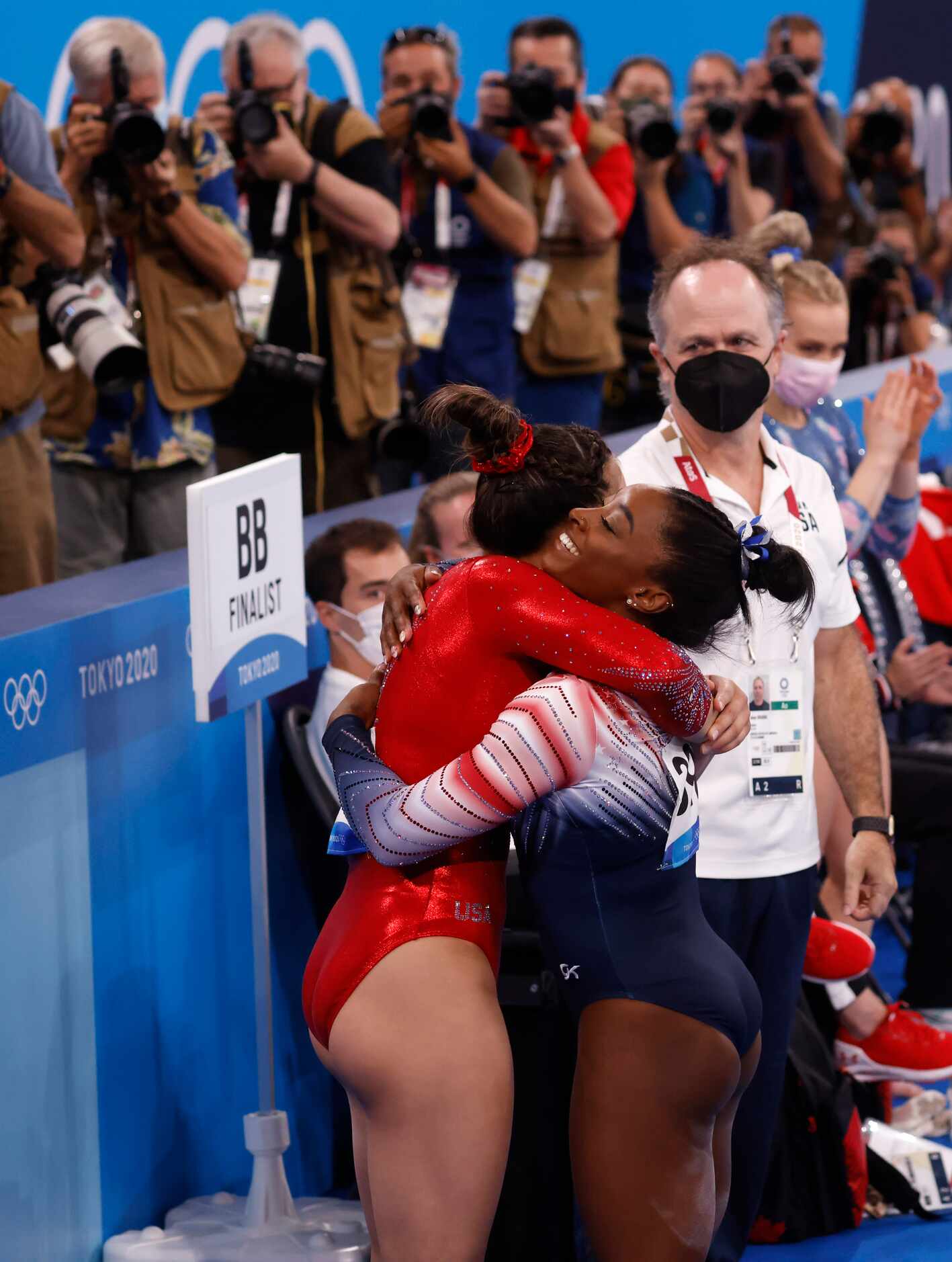 USA’s Simone Biles hugs Sunisa Lee after competing in the women’s balance beam final at the...