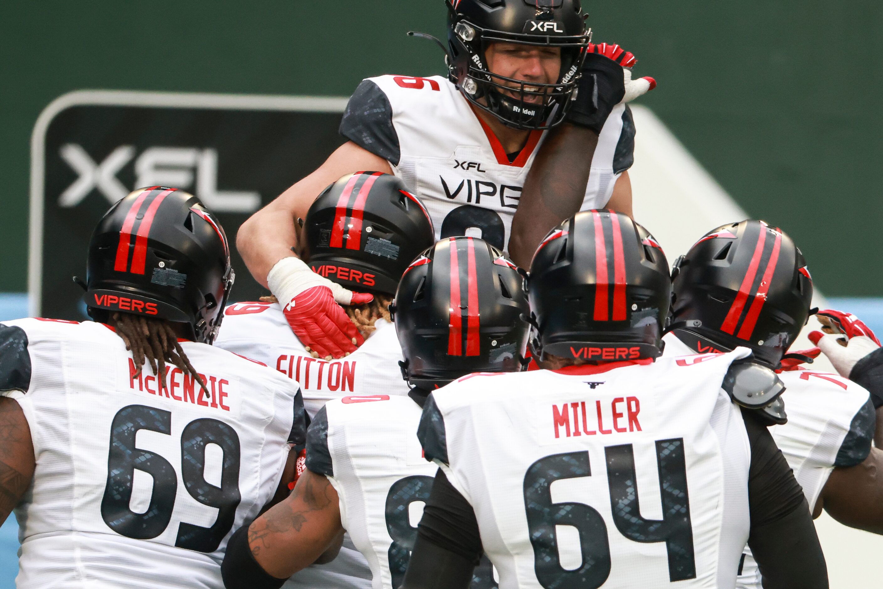 Vegas Vipers Brandon Dillon (86) is hoisted in the air after scoring a two-point conversion...