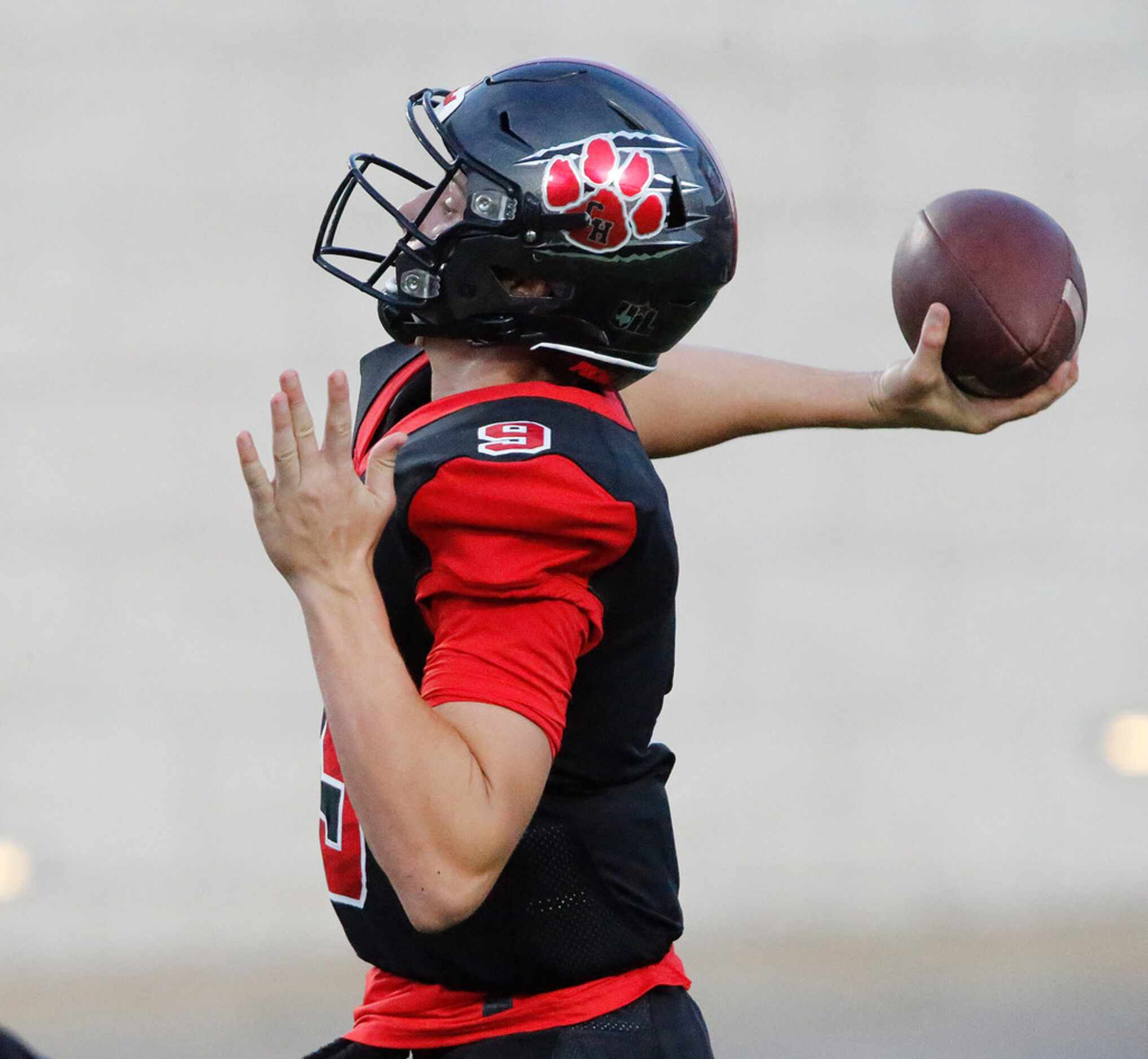Colleyville Heritage High School quarterback AJ Smith (9) launches a deep pass attempt...