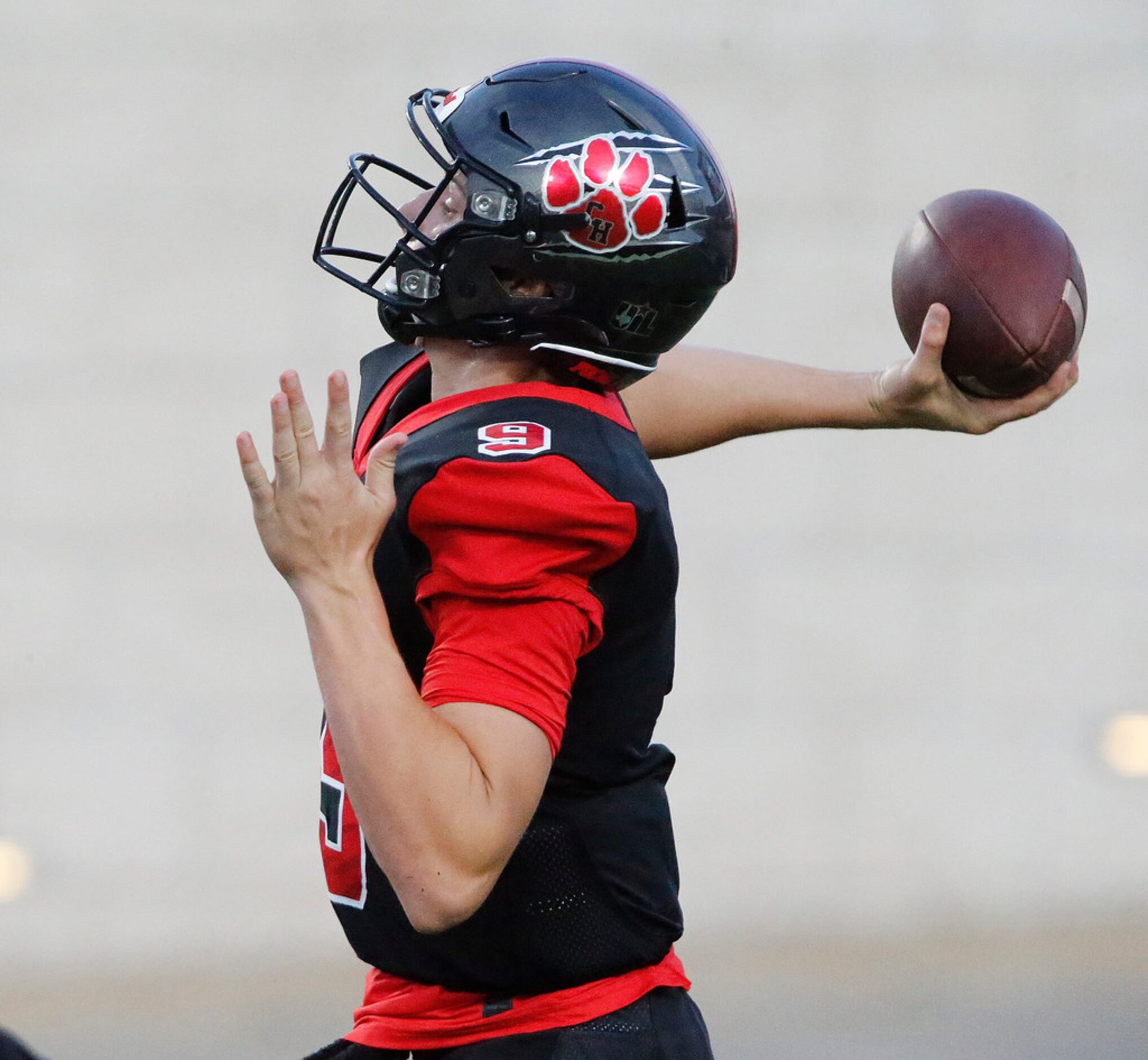 Colleyville Heritage High School quarterback AJ Smith (9) launches a deep pass attempt...