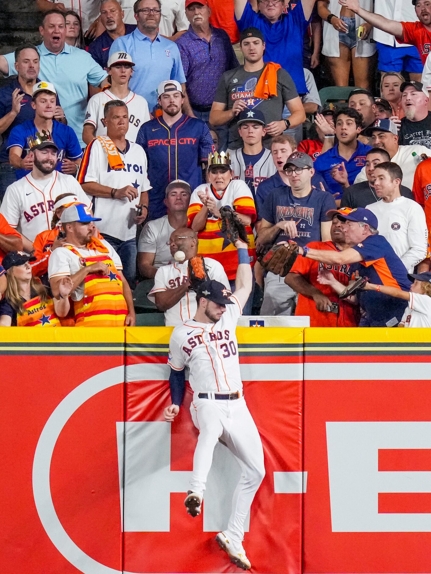 Houston Astros right fielder Kyle Tucker (30) can’t make the play on a  home run ball hit by...