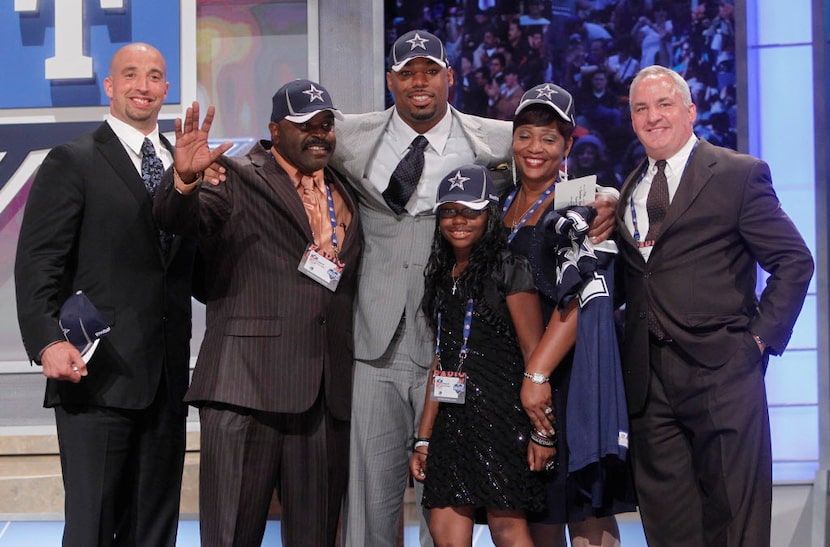 Southern California offensive tackle Tyron Smith poses for photographs with family and...