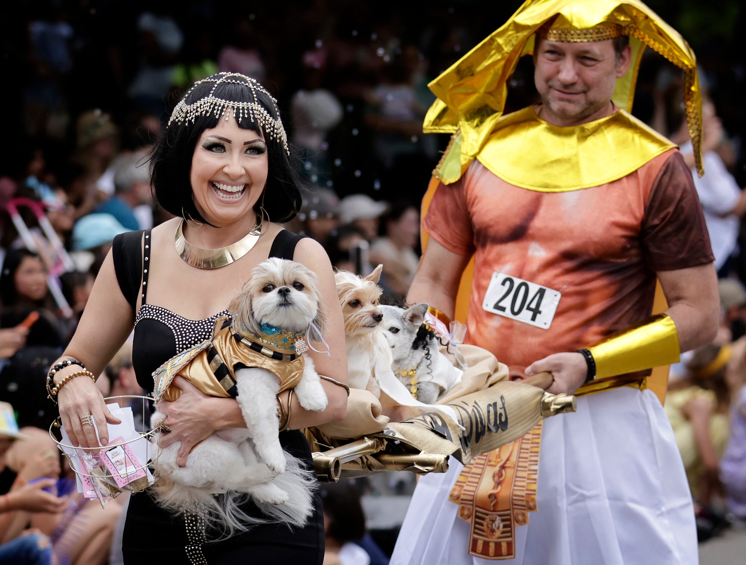 Melanie Fox dressed her Shih Tzu ‘Cleopatra’ (in hand), her Yorkie-mix ‘Ameera’ and...