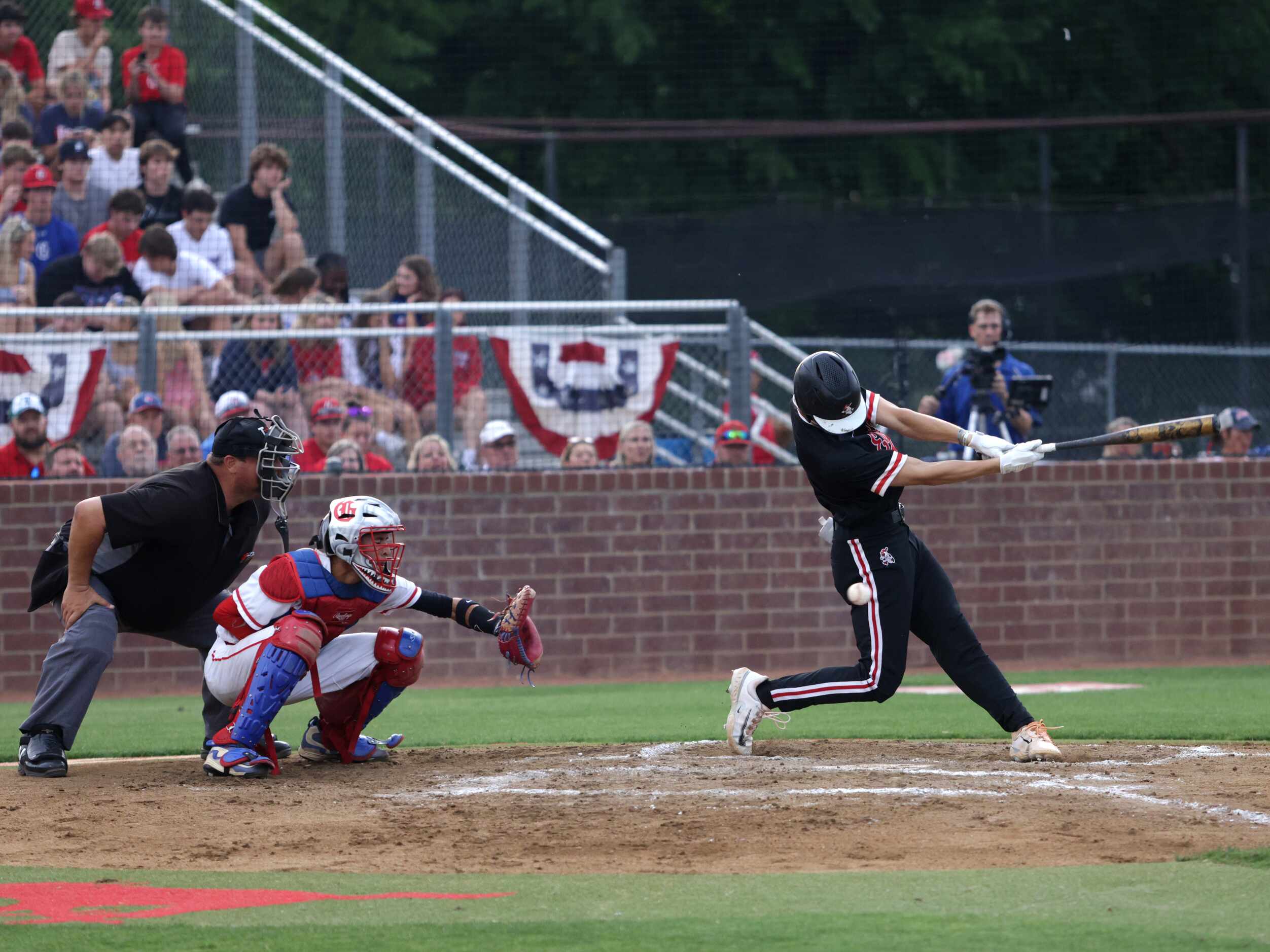 Argyle High School player Brayden Rosckes swings and misses during a game against Grapevine...