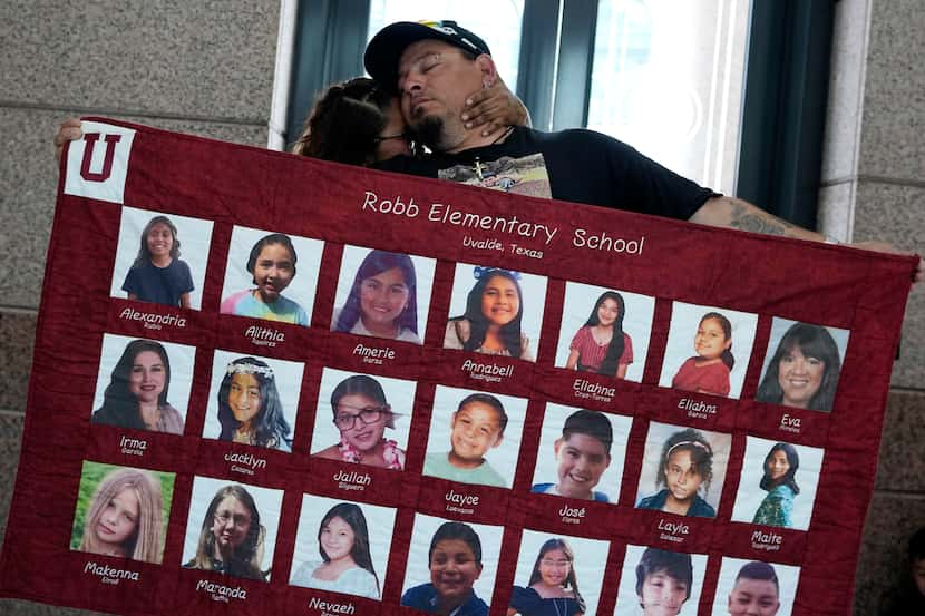 Abel Lopez, right, father of Xavier Lopez who was killed in the shootings in Uvalde, holds a...