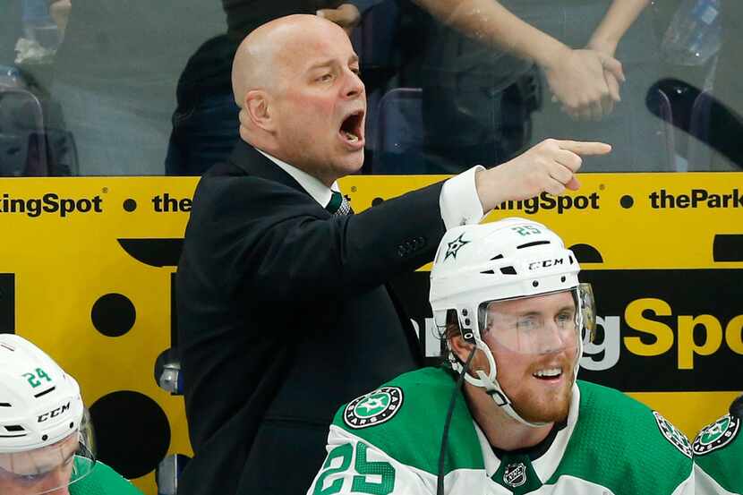 Dallas Stars head coach Jim Montgomery yells to his players during the third period of play...