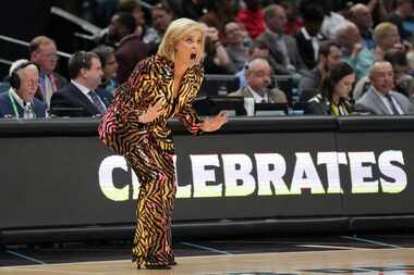 LSU head coach Kim Mulkey calls to her players during the first half of the NCAA Women's...