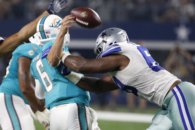Miami Dolphins quarterback Brandon Doughty (6) fumbles the ball after being hit by Dallas...