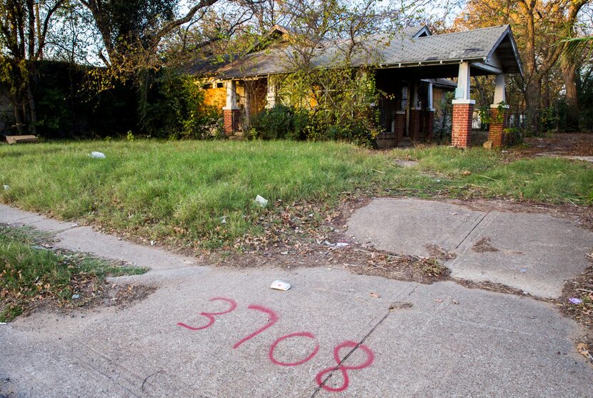 This house on Malcolm X Boulevard is one of seven the city is eyeing for demolition. It was...