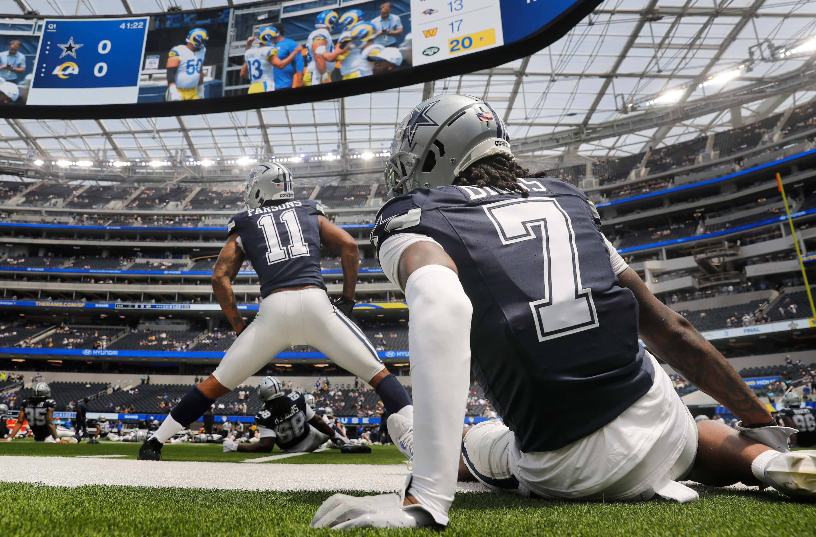 Dallas Cowboys linebacker Micah Parsons (11) and cornerback Trevon Diggs (7) stretch before...