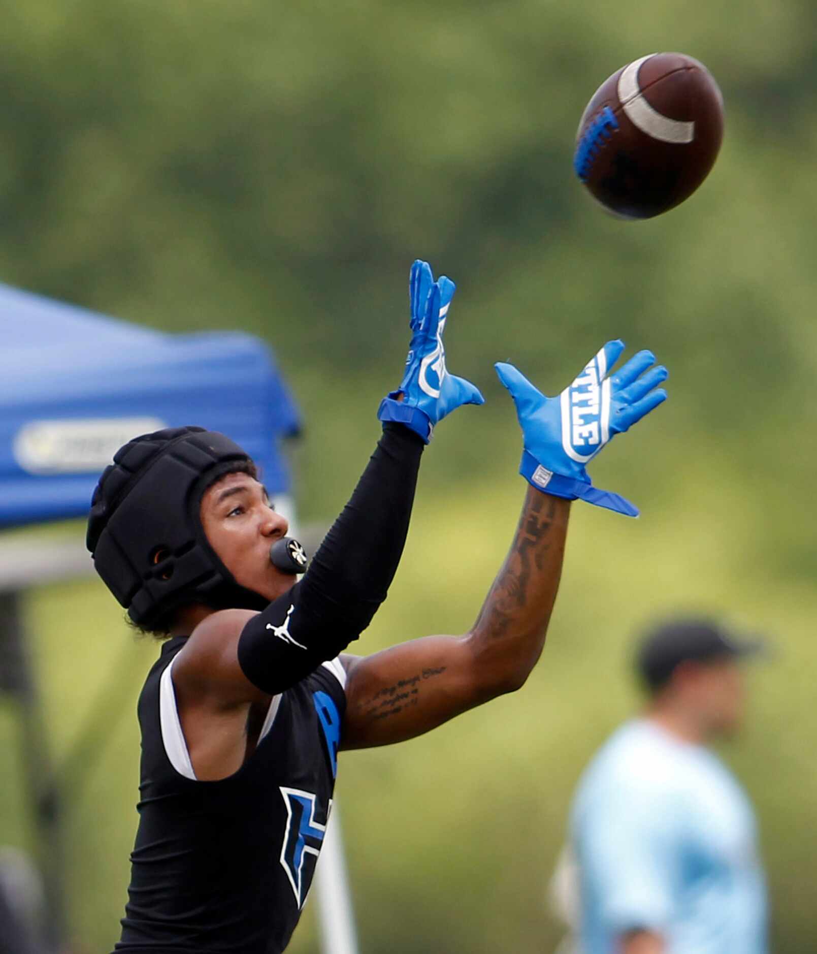 Hebron receiver Takoda Bridges (8) pulls in a touchdown pass during day 1 competition...