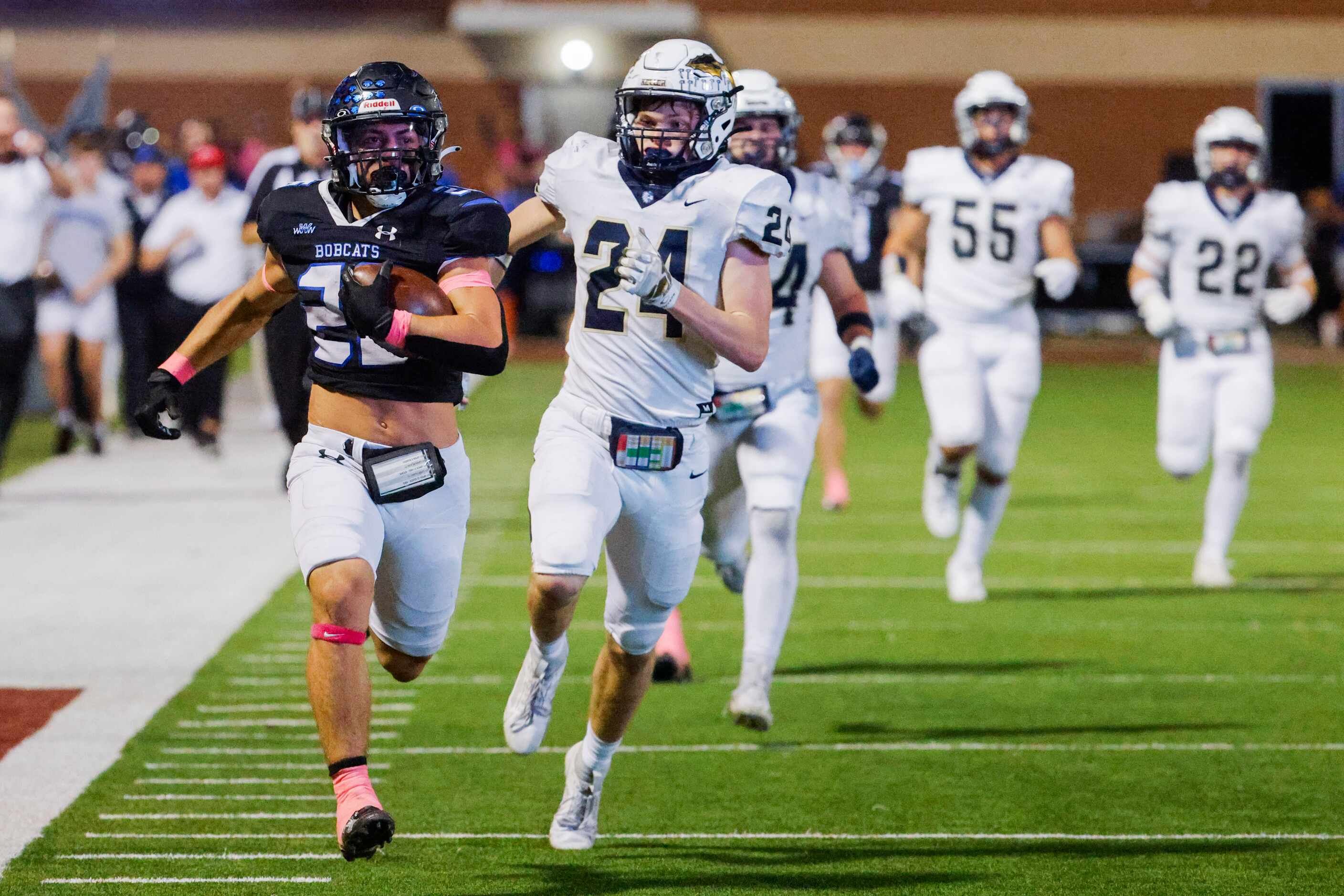 Byron Nelson’s Tucker James (26) runs past Keller high’s TJ Worthy (24) as he scores a...