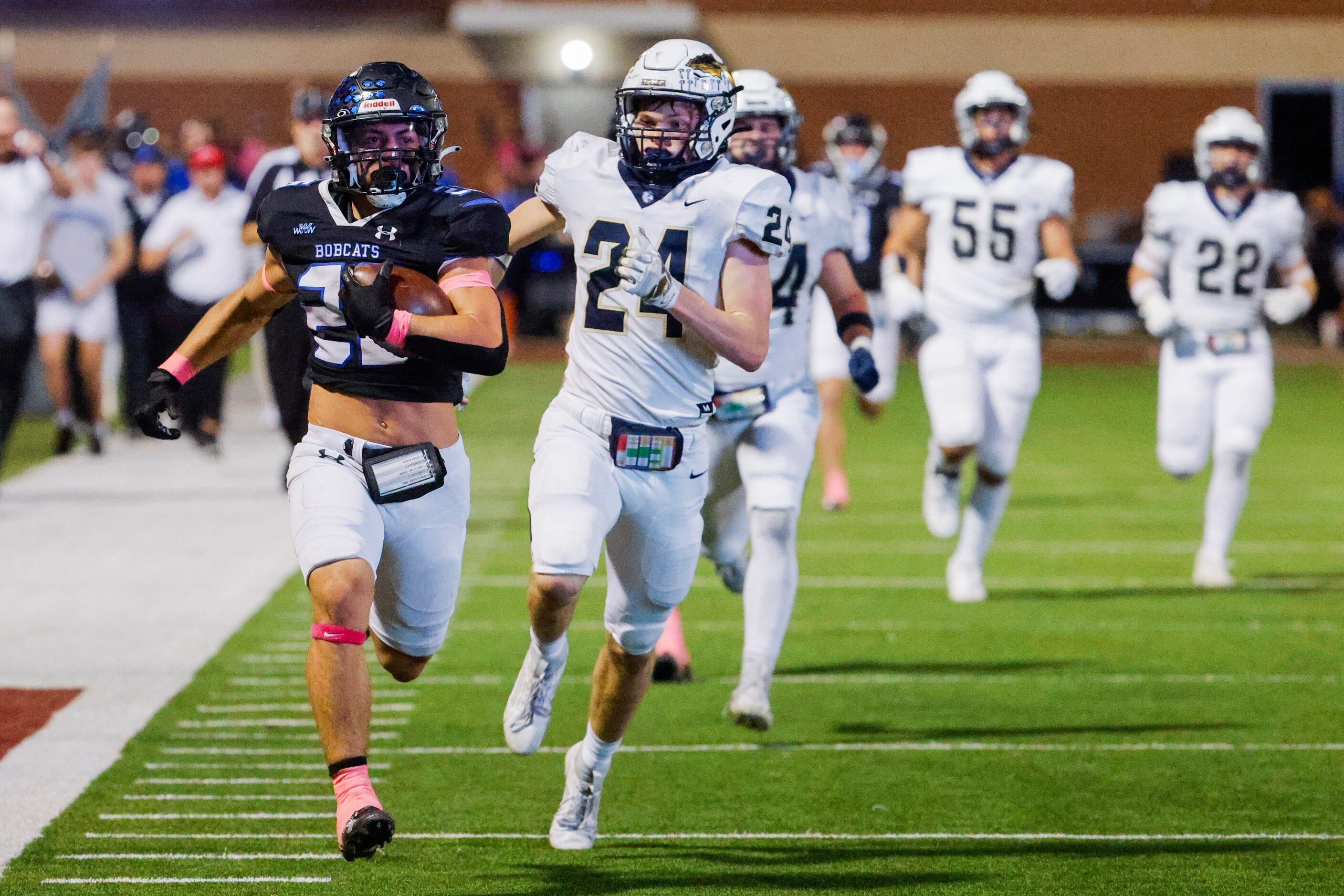 Byron Nelson’s Tucker James (26) runs past Keller high’s TJ Worthy (24) as he scores a...