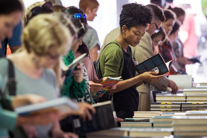 People browse books for sale during the Texas Book Festival in Austin on Saturday, Nov. 4,...