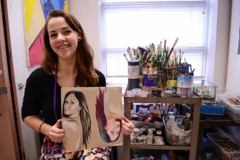 Alexis Politz, a Richardson High School graduate, displays a piece of her artwork in the...