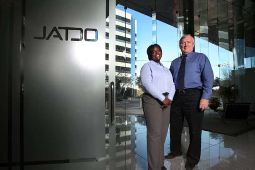 Customer support manager LaKeshia Cox and credit manager Curt Karstens, conduct business...