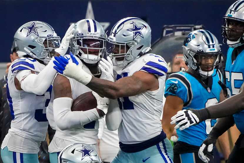 Dallas Cowboys cornerback Trevon Diggs (7) celebrates with linebacker Micah Parsons (11) and...