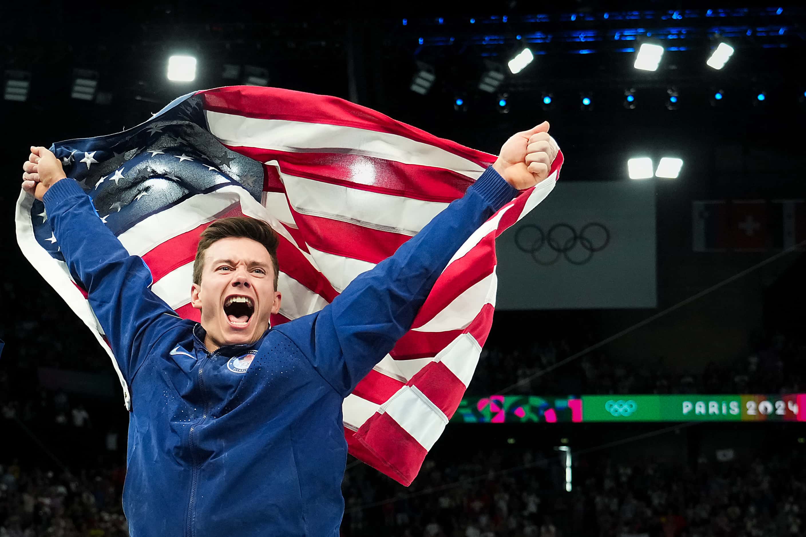 Brody Malone of the United States celebrates after winning the bronze medal in the men’s...