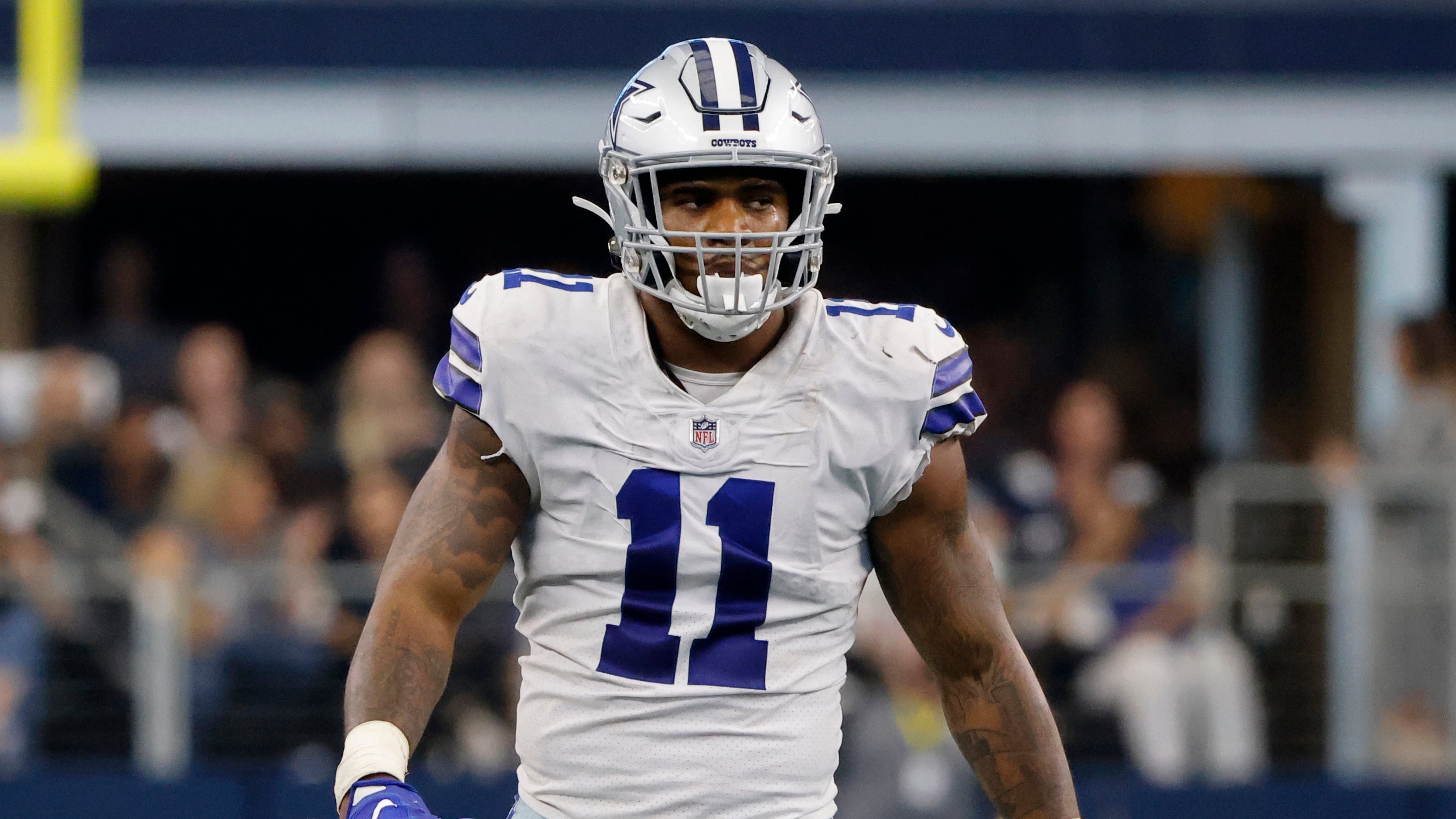 Dallas Cowboys linebacker Micah Parsons (11) and Leighton Vander Esch (55)  huddle with other defensive player during a Thanksgiving day NFL football  game against the Las Vegas Raiders, Thursday, Nov. 25, 2021