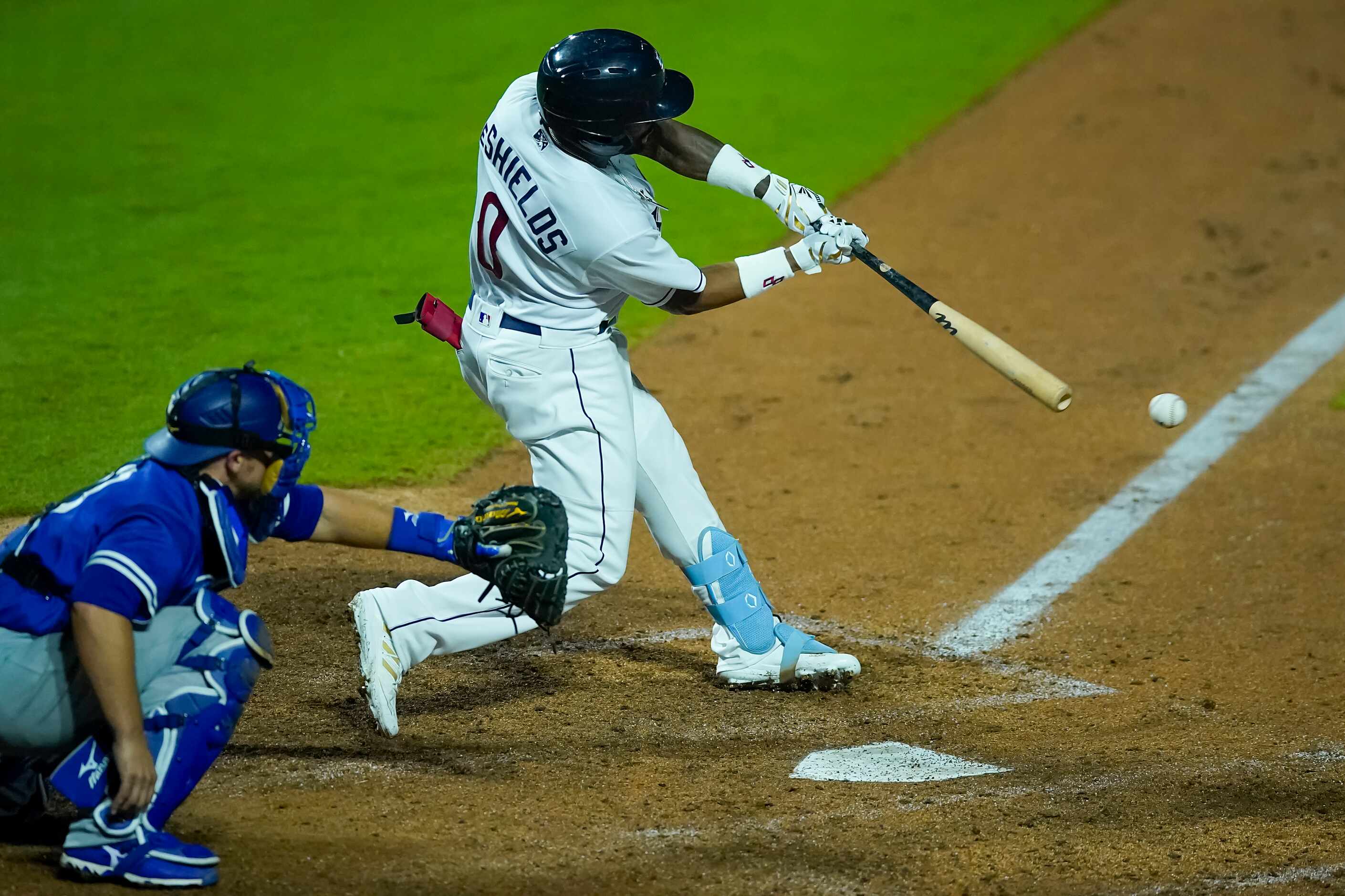 Round Rock Express outfielder Delino DeShields drives in two runs with a double during the...