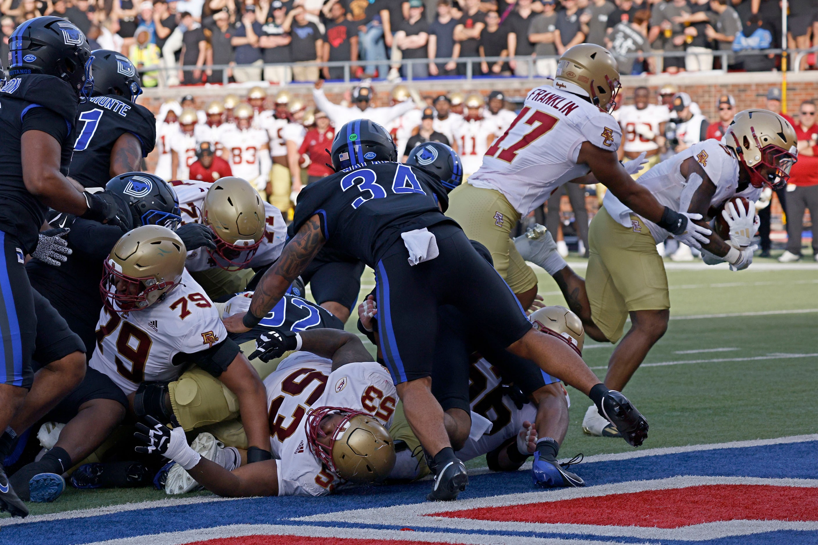 Boston College running back Kye Robichaux (5), far right, scores a touchdown over SMU during...