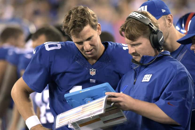 FILE - In this Aug. 22, 2015, file photo, New York Giants offensive coordinator Ben McAdoo...