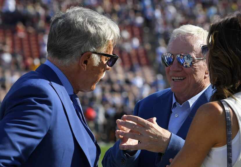 Los Angeles Rams owner Stan Kroenke, left, talks with Dallas Cowboys owner Jerry Jones,...