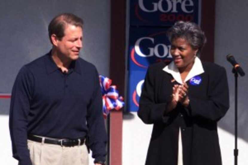  Vice President Al Gore is applauded by his campaign chairman, Donna Brazile, right, at the...