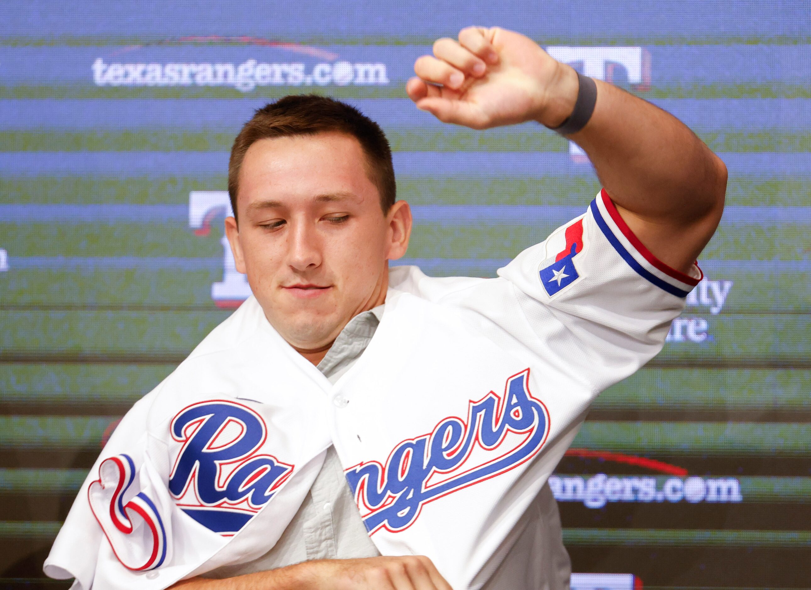 Texas Rangers top pick Wyatt Langford wears the jersey during press conference announcing...