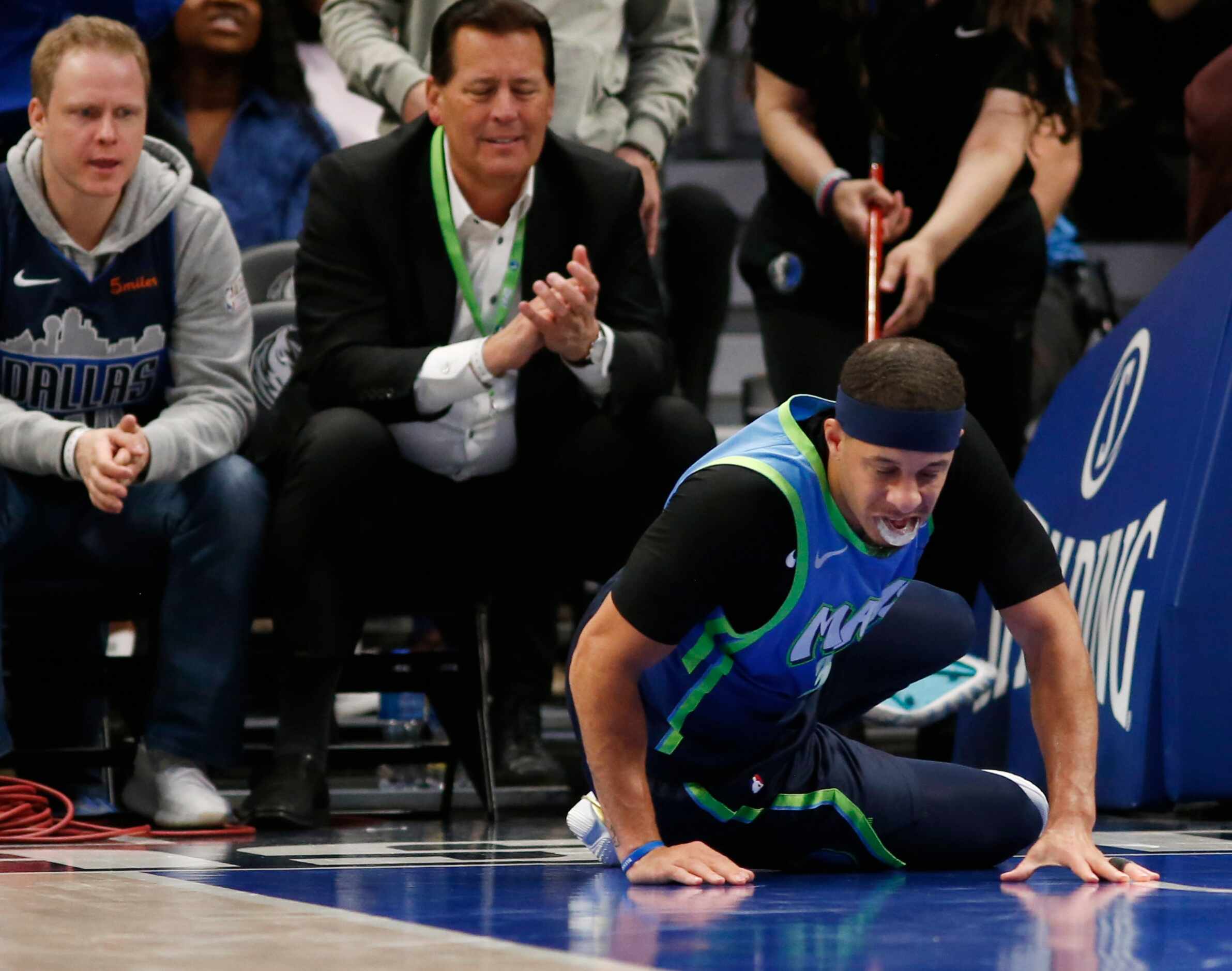 Dallas Mavericks guard Seth Curry (30) is slow to get up after injuring himself in a game...