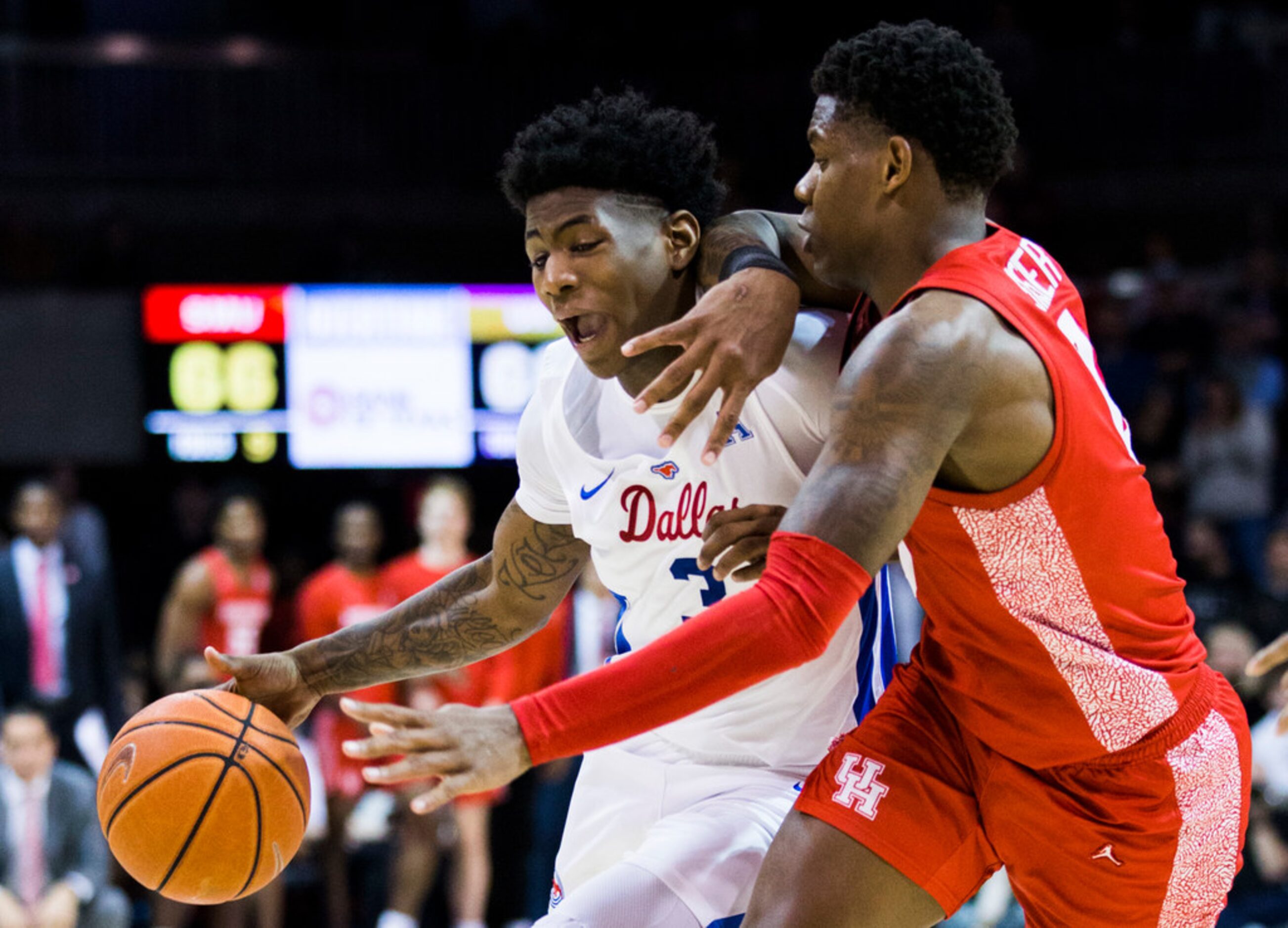 Southern Methodist Mustangs guard Kendric Davis (3) is defended by Houston Cougars guard...